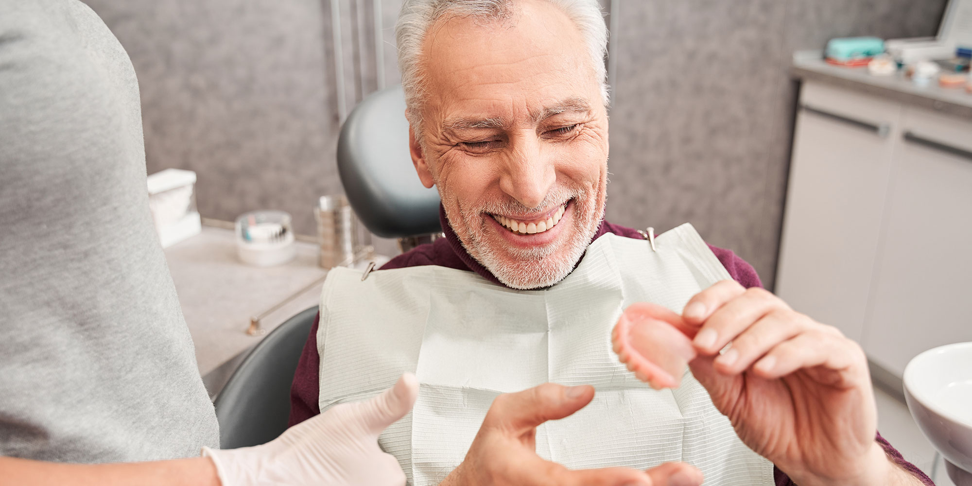 Man Holding dentures