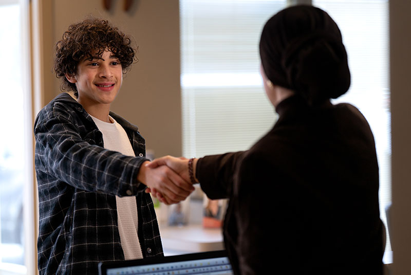 Patient shaking Team members hand