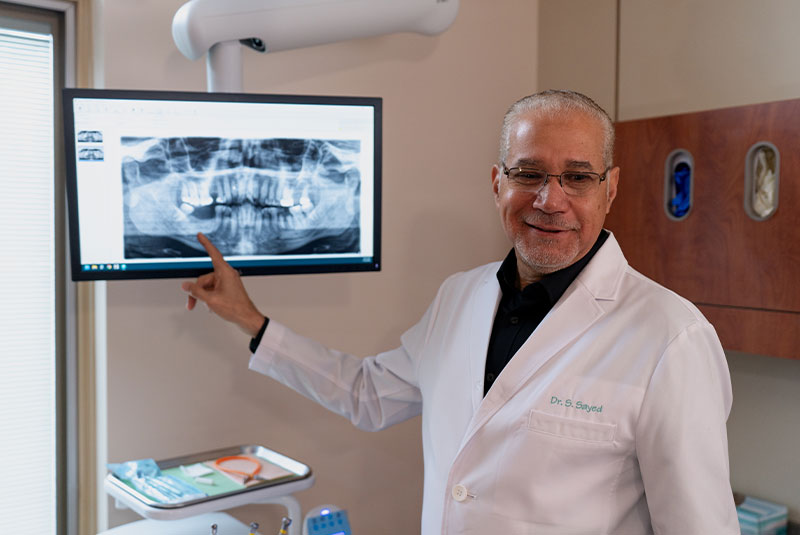 Doctor pointing at dental implants