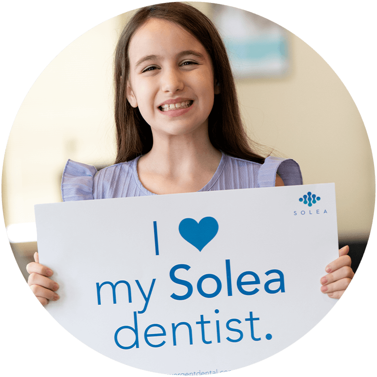 Paitent holding up a Solea Sign