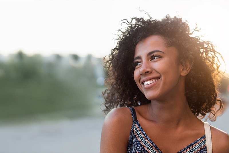 beautiful women smiling brightly outside