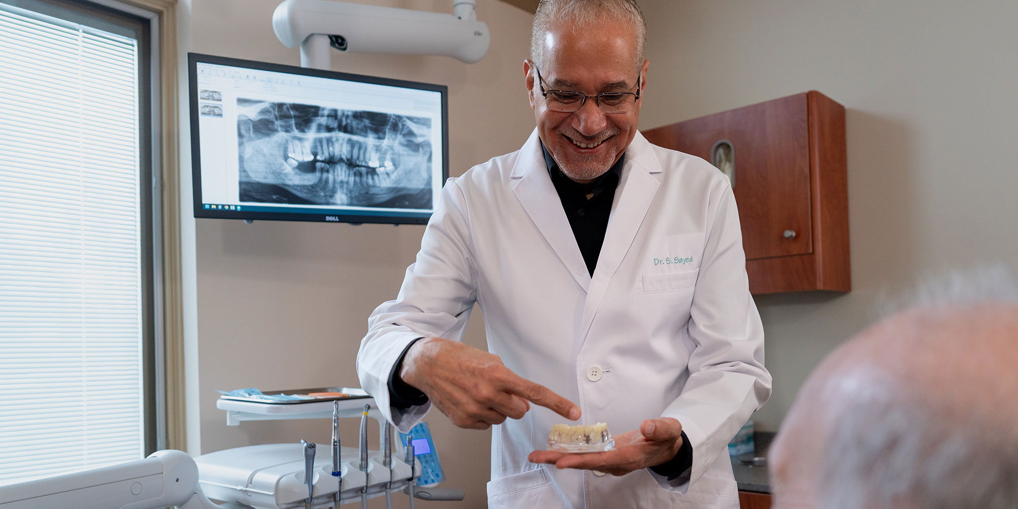 Doctor Pointing at implants