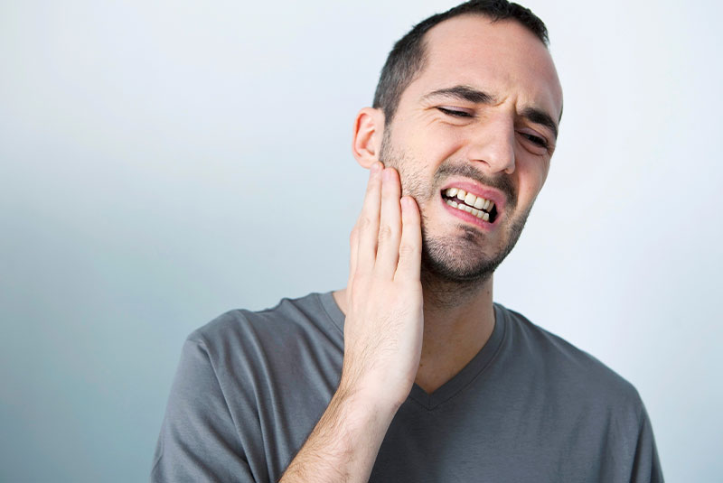 Patient Holding mouth in pain